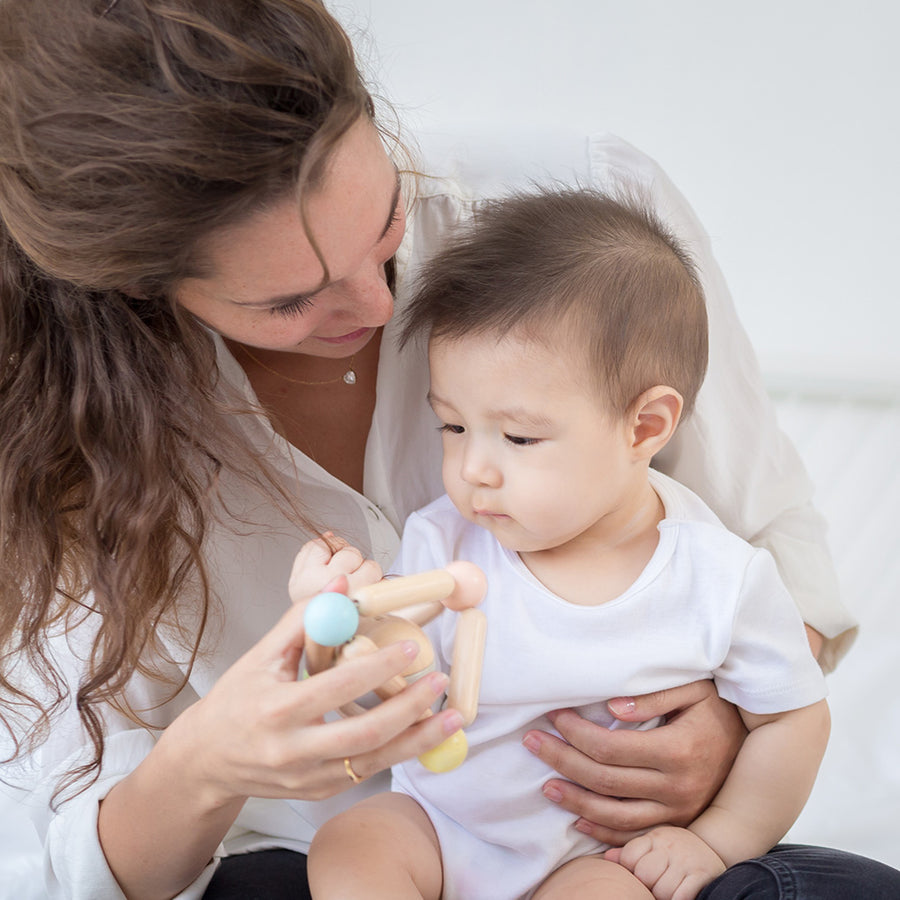 Pastel Triangle Clutching Toy by PlanToys